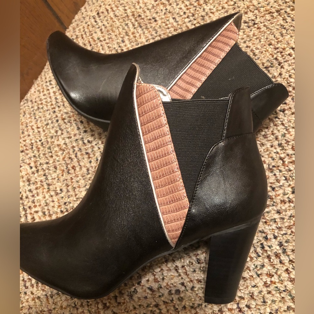 New in the package mark. Sideswipe booties black and tan. Size 6,8 and 10